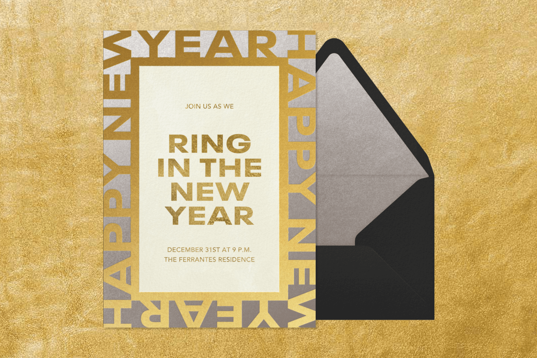 A card reads “ring in the new year” in gold block letters with the words “happy new year” forming a frame.