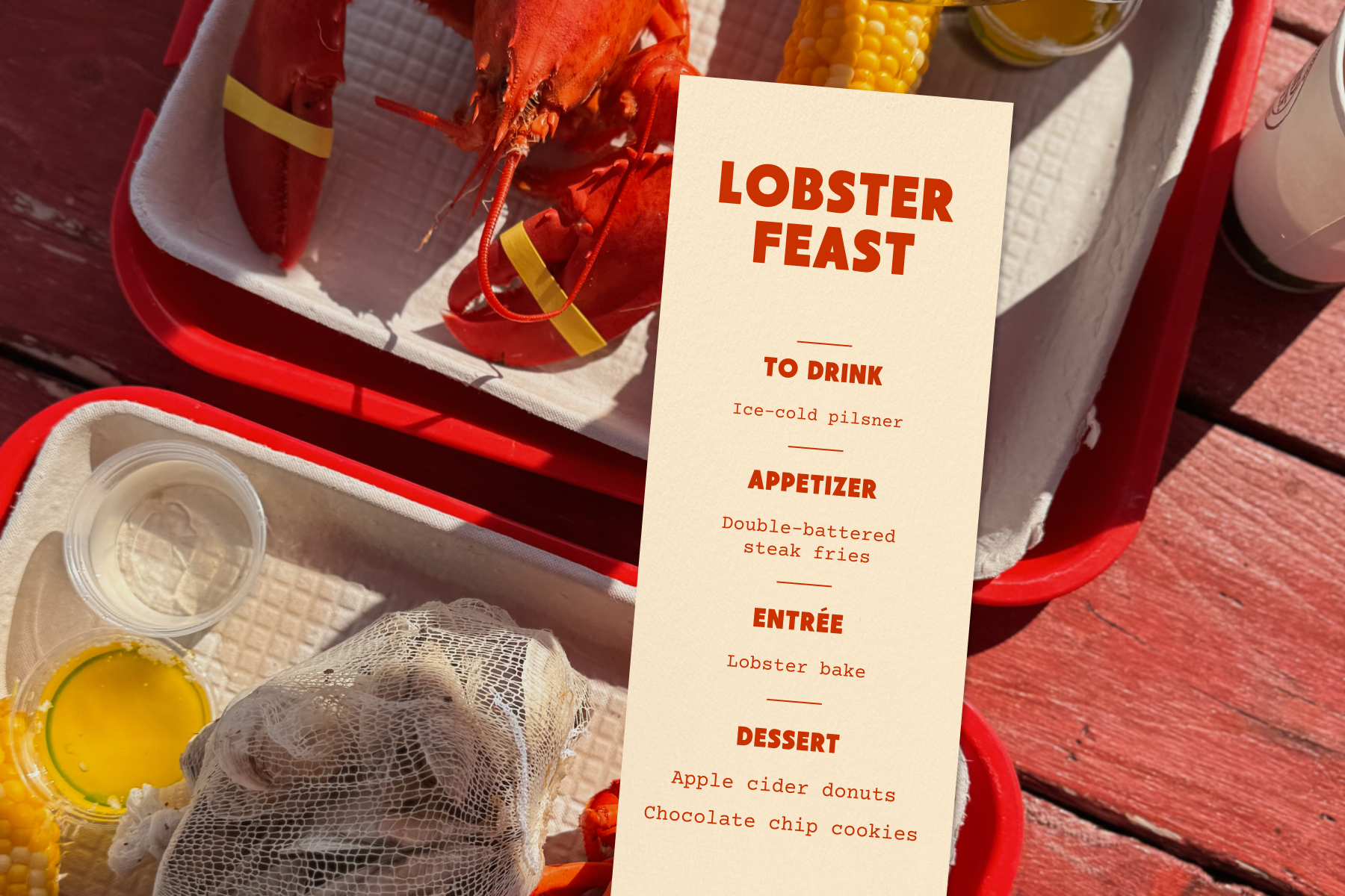 A menu for a lobster feast sits over a backdrop image of lobster, corn, beer, and shellfish on top of a red picnic table.