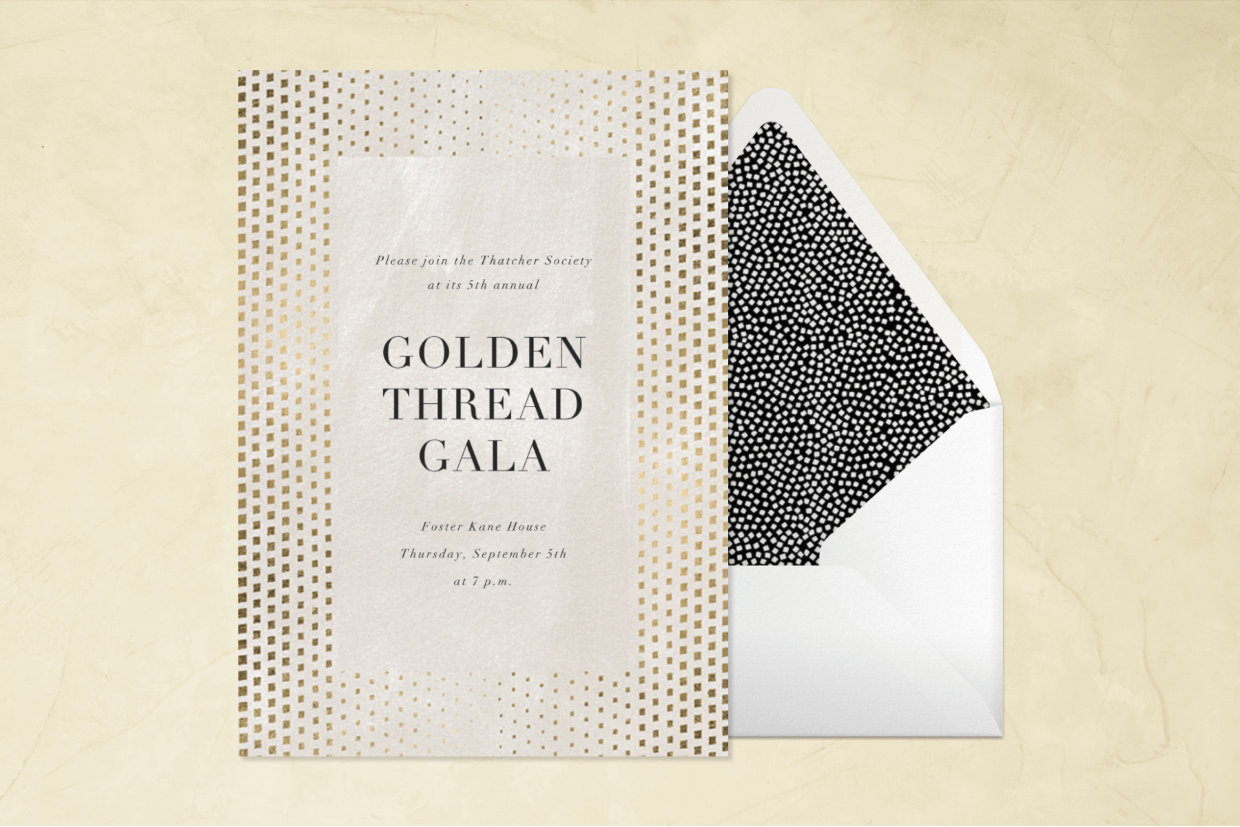 A “Golden Thread Gala” invitation in off-white with a wide border of gold dots in varying sizes.