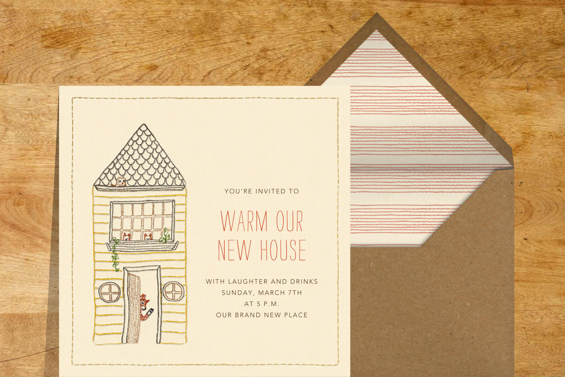 A housewarming invitation featuring an embroidered illustration of a fox waving from inside a house.