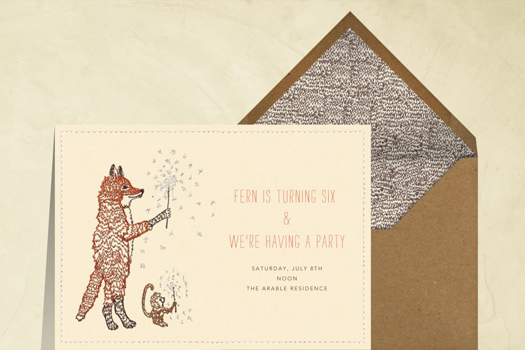 A party invitation featuring an embroidered illustration of a fox and a monkey lighting sparklers.