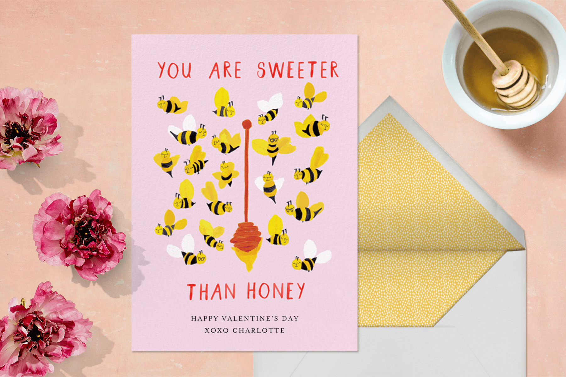 A Valentine’s Day card featuring bees around a honey dipper.