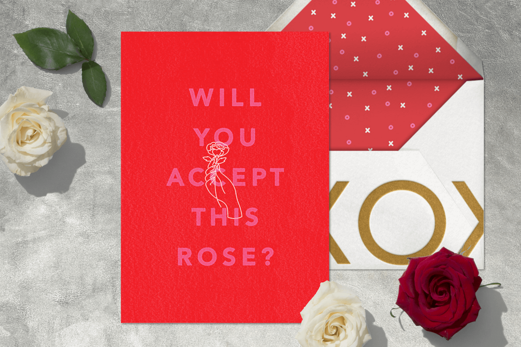 A red Valentine’s Day card featuring a hand holding a rose.