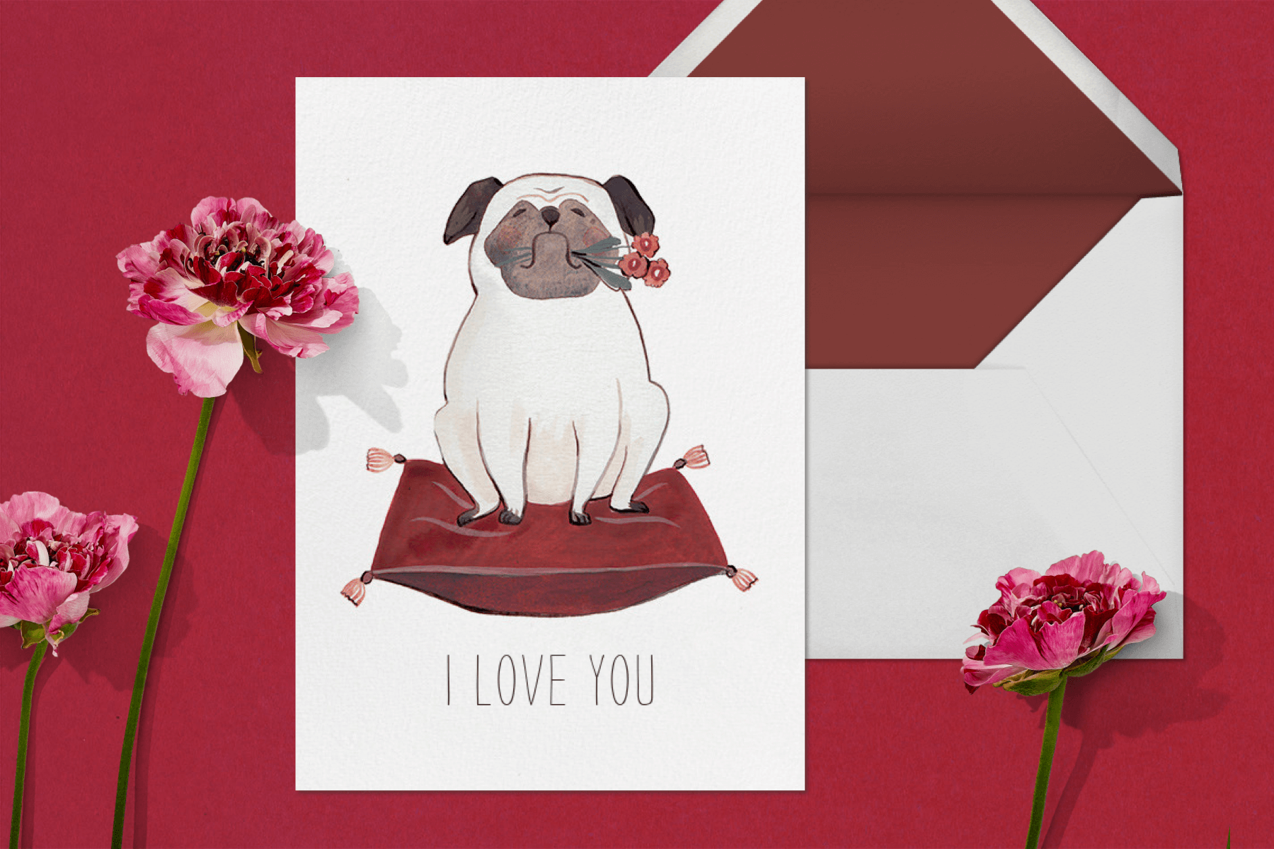 A Valentine’s Day card featuring a pug on a pillow.
