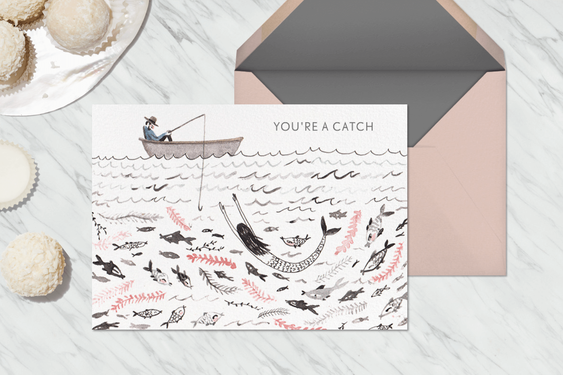 A Valentine’s Day card with an illustration of a fisherman catching a mermaid.
