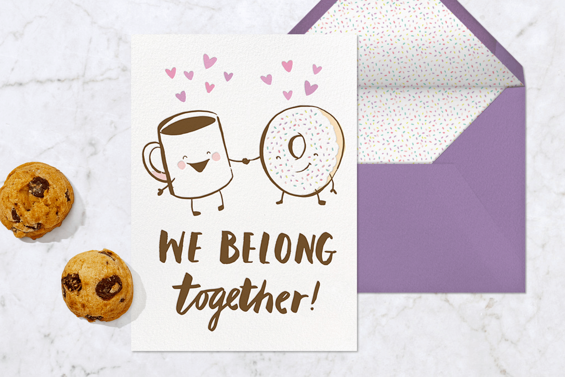 A card with an illustration of a coffee and a donut holding hands.