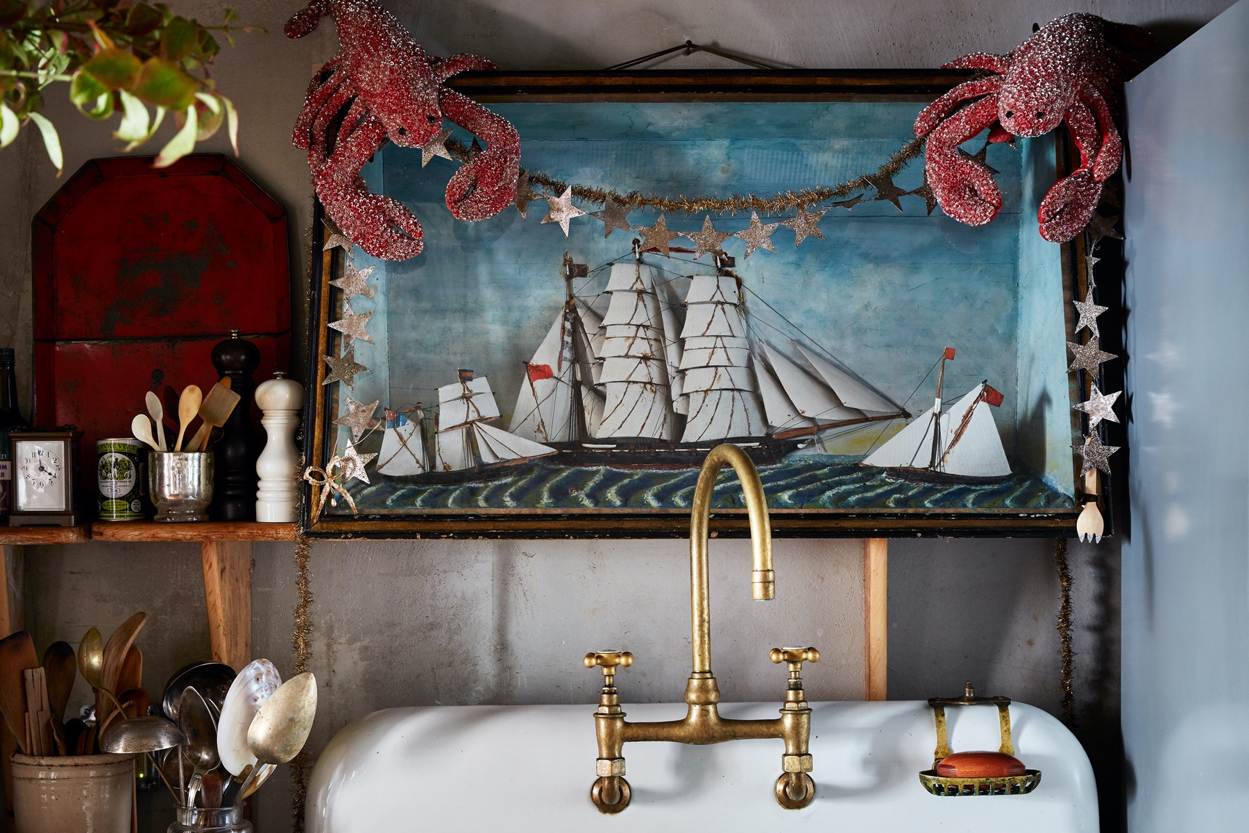 John Derian’s sink decorated for the holidays with glittery lobsters and navel artwork.