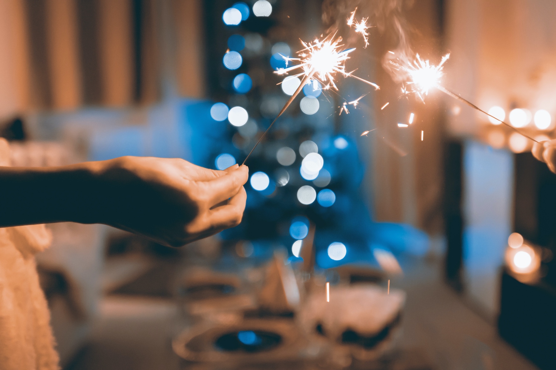 Close up of hands holding sparklers