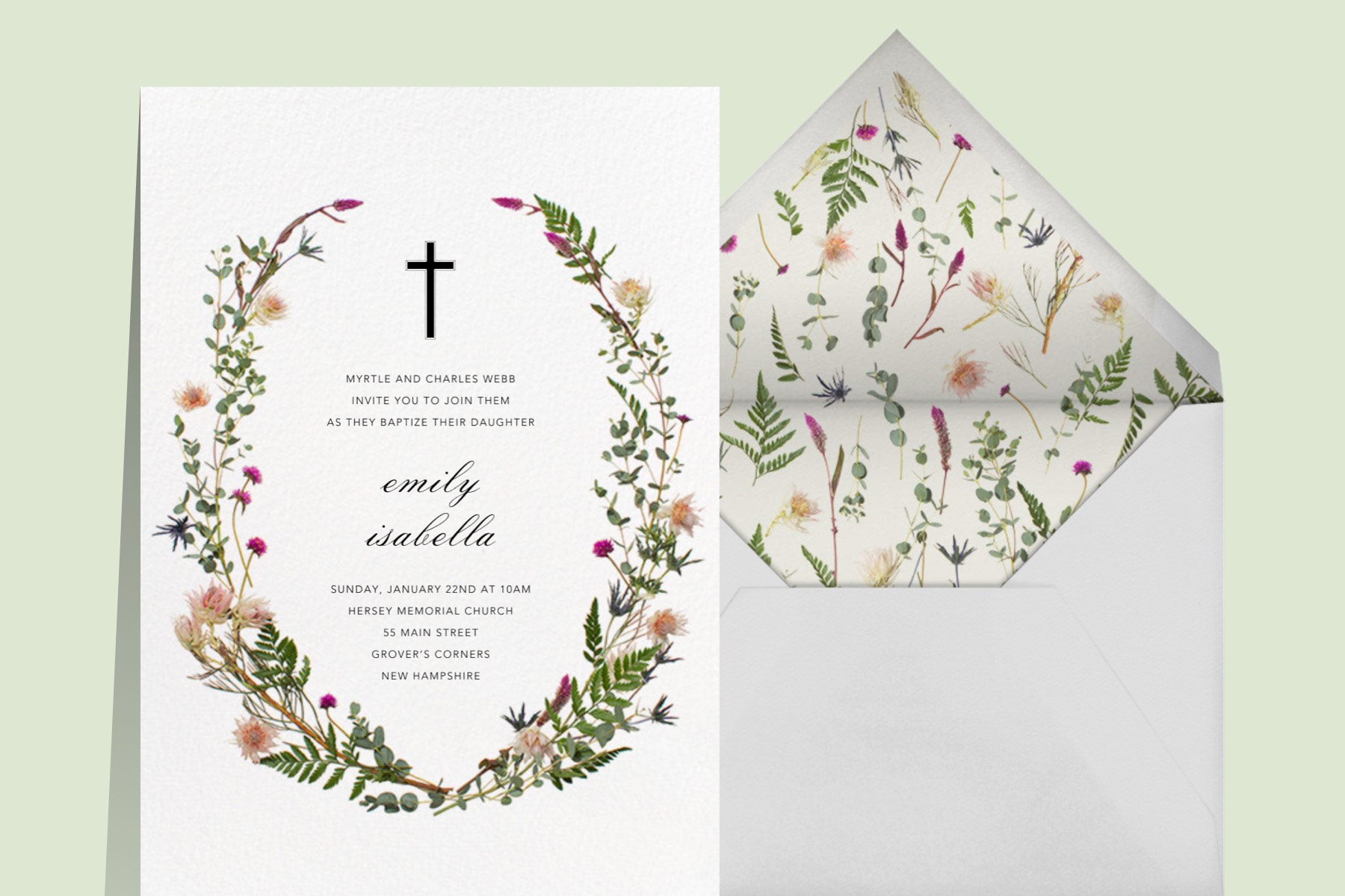 A card with a wildflower wreath border and small cross. 