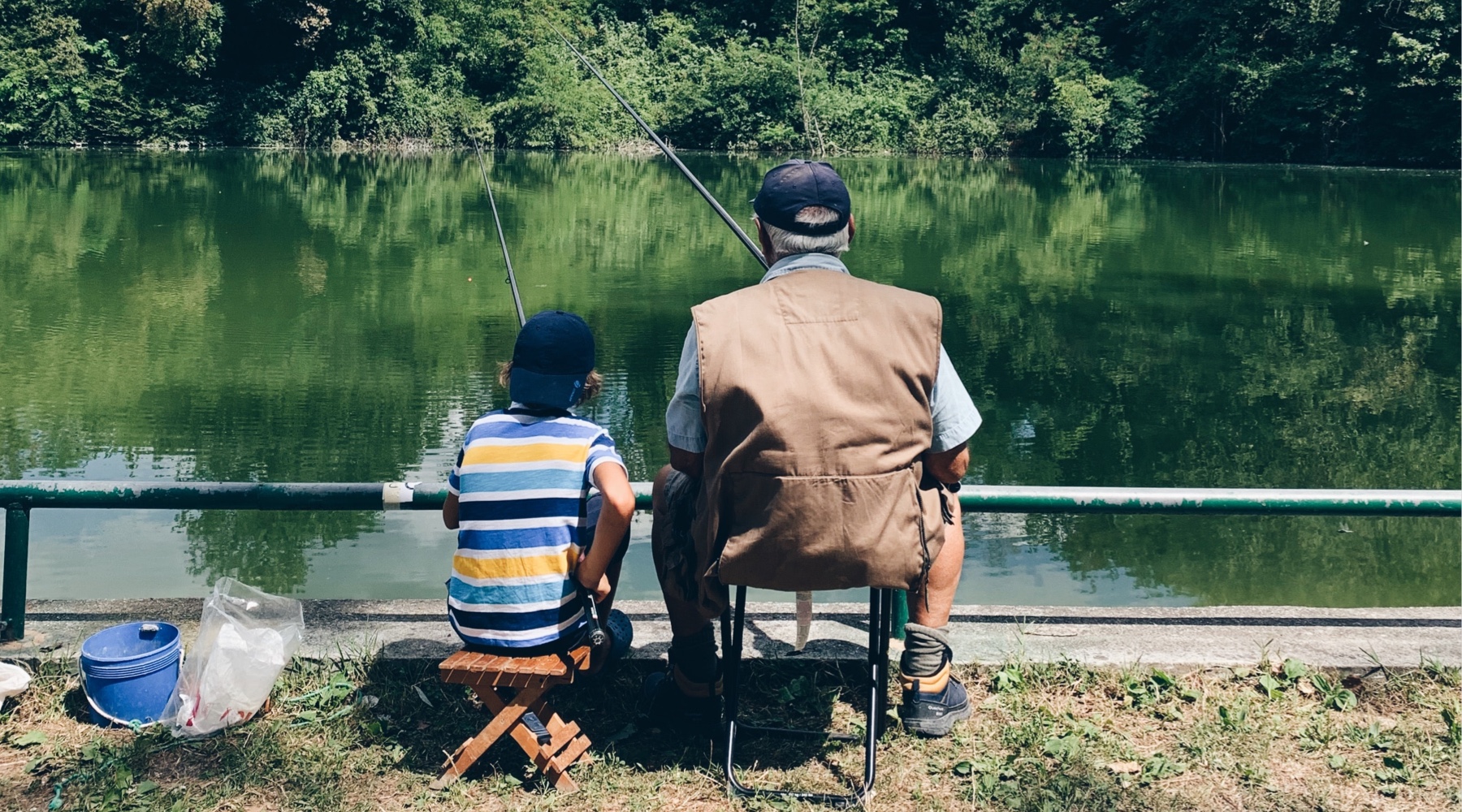 Father and son fishing in chairs