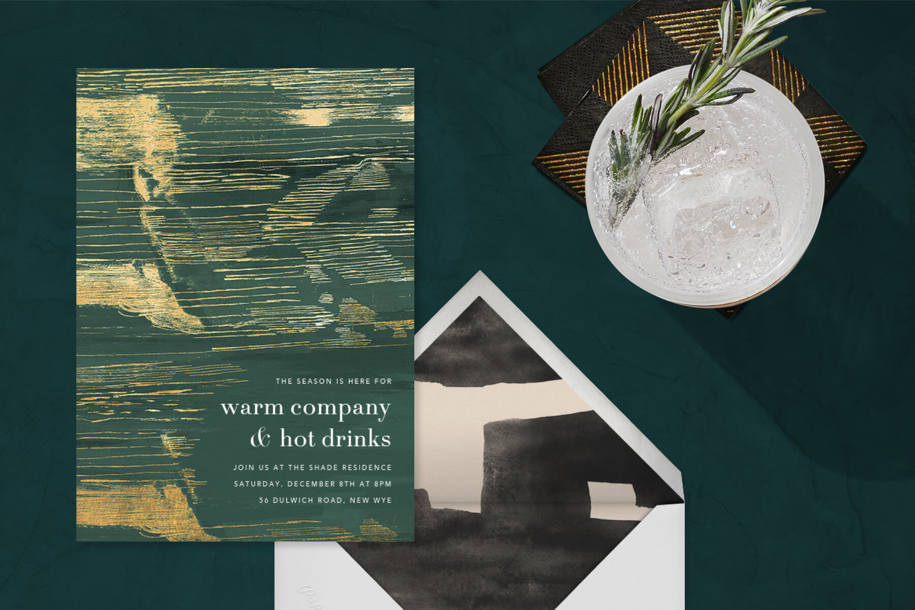 office holiday party ideas for 2020 featuring Kelly Wearstler invitation and gin and rosemary cocktail