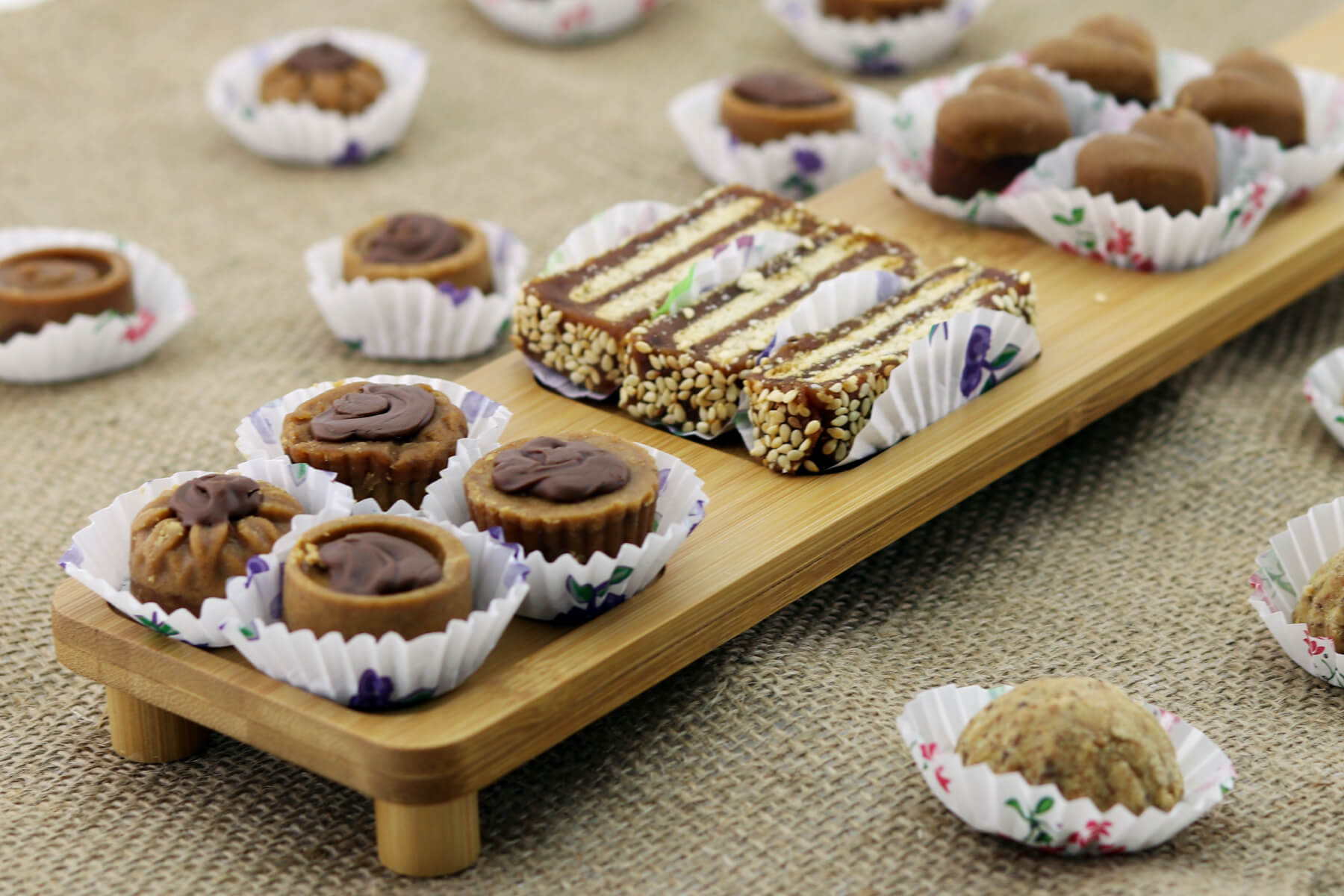 Ramadan treats displayed on a wooden platter.